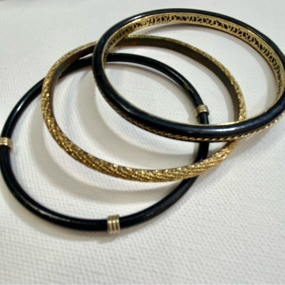 Three metal gold and black bangle bracelets - Picture 1 of 6